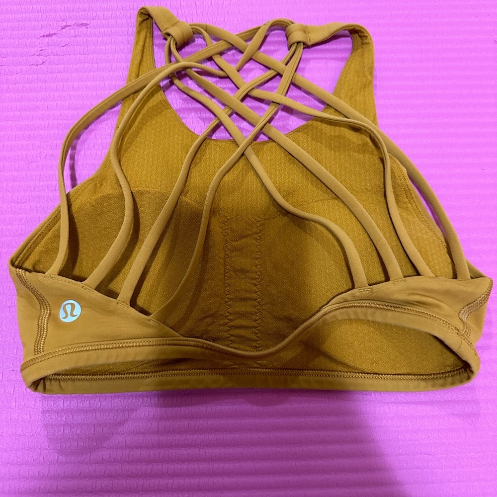 Lululemon strappy sports bra. Beautiful earth color! New without tags! Pads